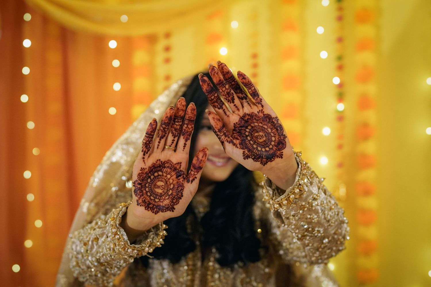 photography of bride's henna on henna night at a dholki event