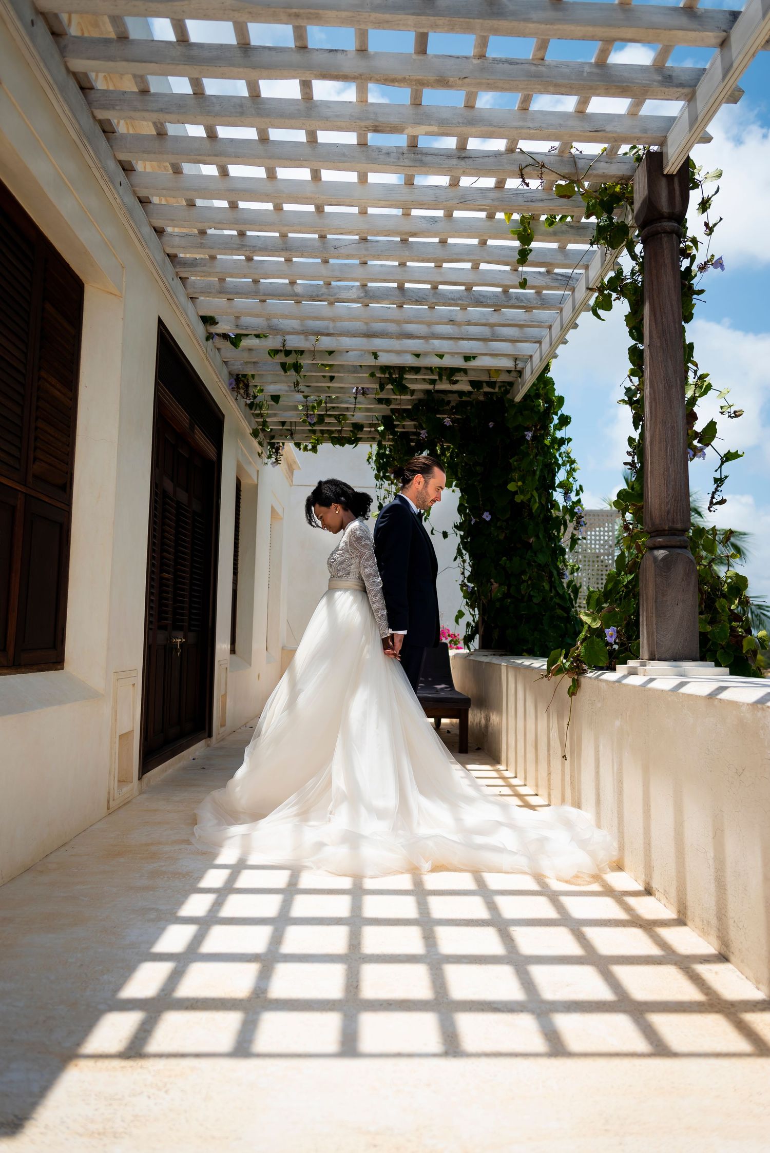 A series of photos showing a white pergola walkway with dramatic shadows creating geometric patterns on the wall.