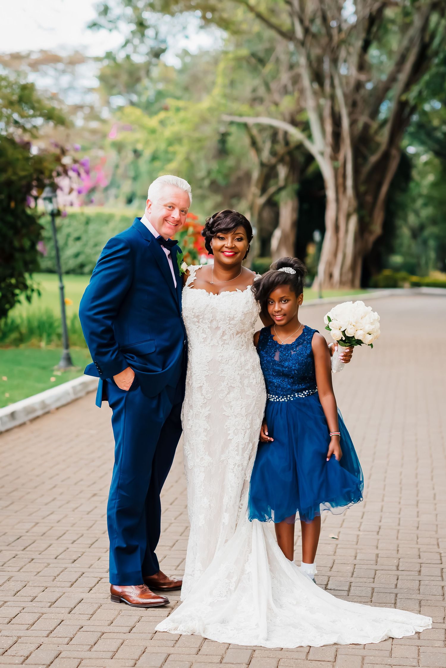 A heartwarming wedding photo sequence showing sweet moments between the couple and a young bridesmaid in navy blue.