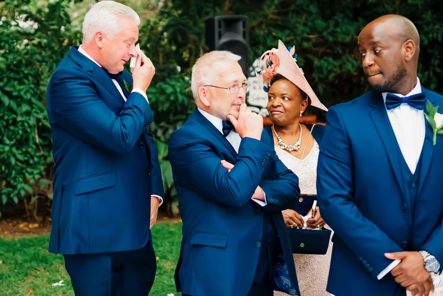 A sequence of six photos showing wedding party members in navy blue suits sharing drinks outdoors.