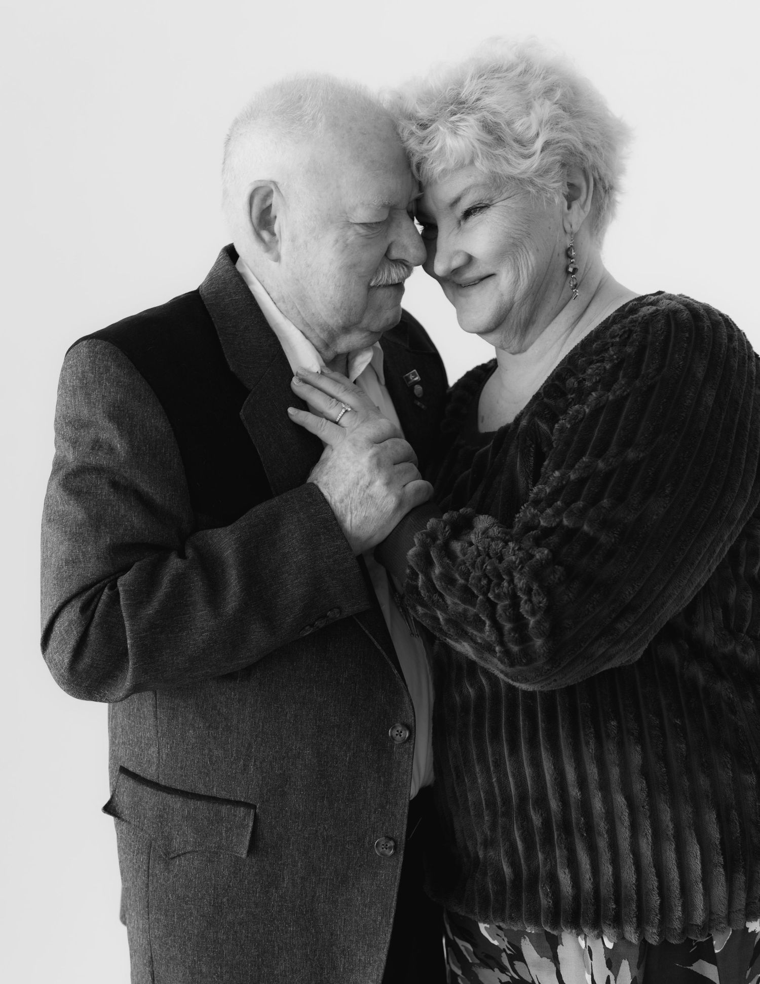 An intimate black and white portrait session capturing tender moments.
