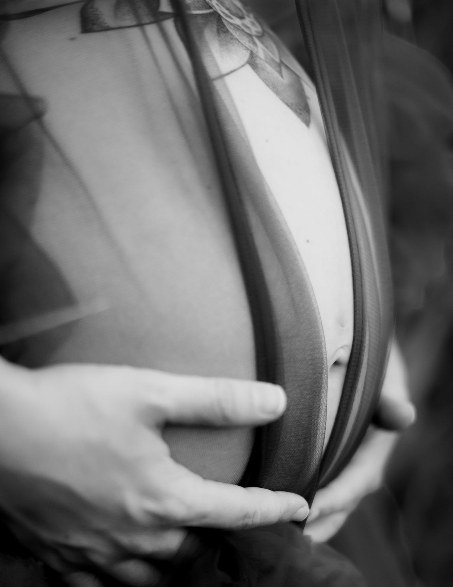 Black and white close-up shots highlighting maternity details.