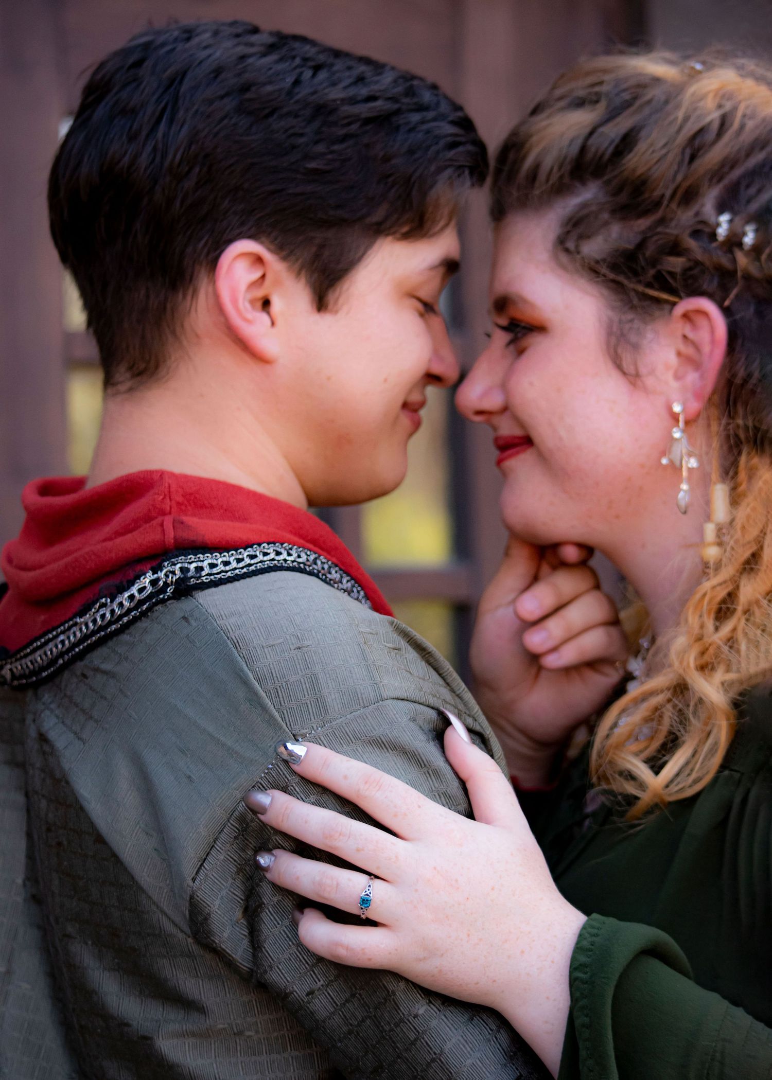 A tender romantic moment shared between a couple in formal attire with vintage styling.
