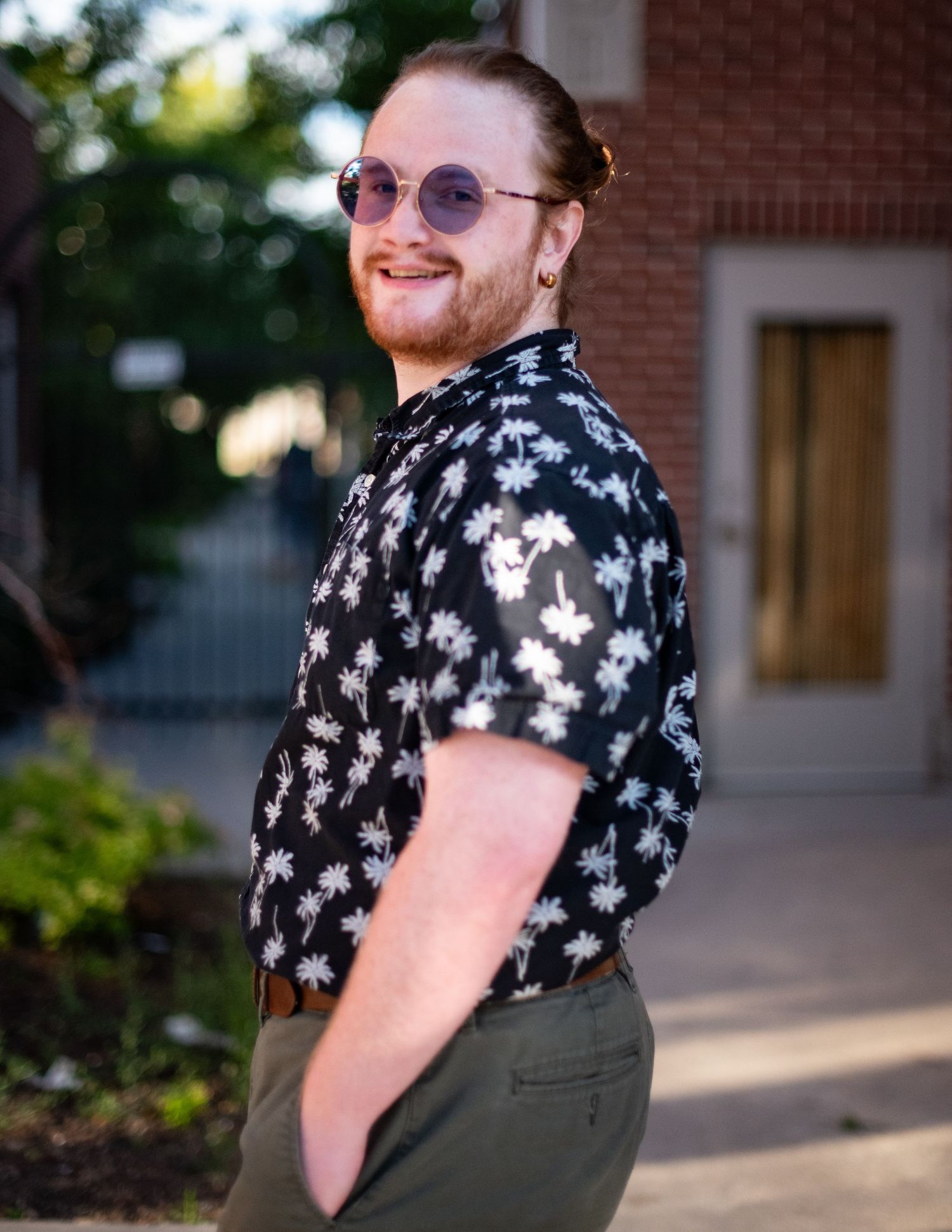 Casual outdoor portraits featuring floral print shirt and olive green pants in summer lighting.