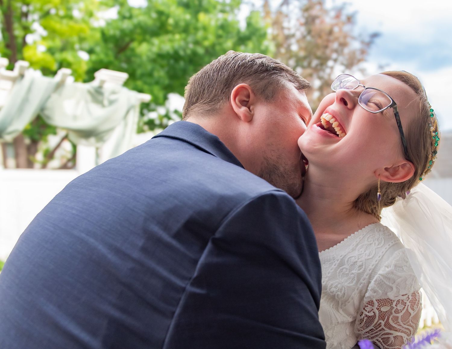 Joyful wedding moment captured during outdoor ceremony.