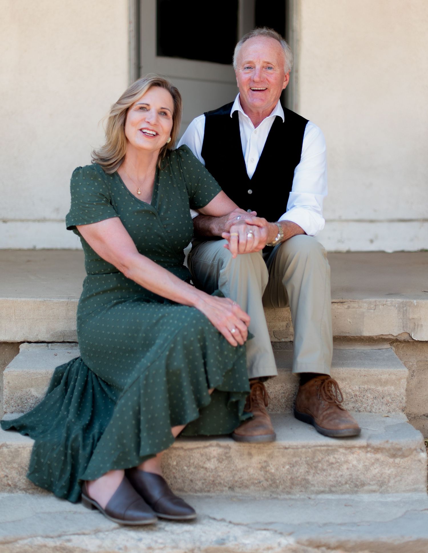 A casual portrait session on stone steps with natural lighting.
