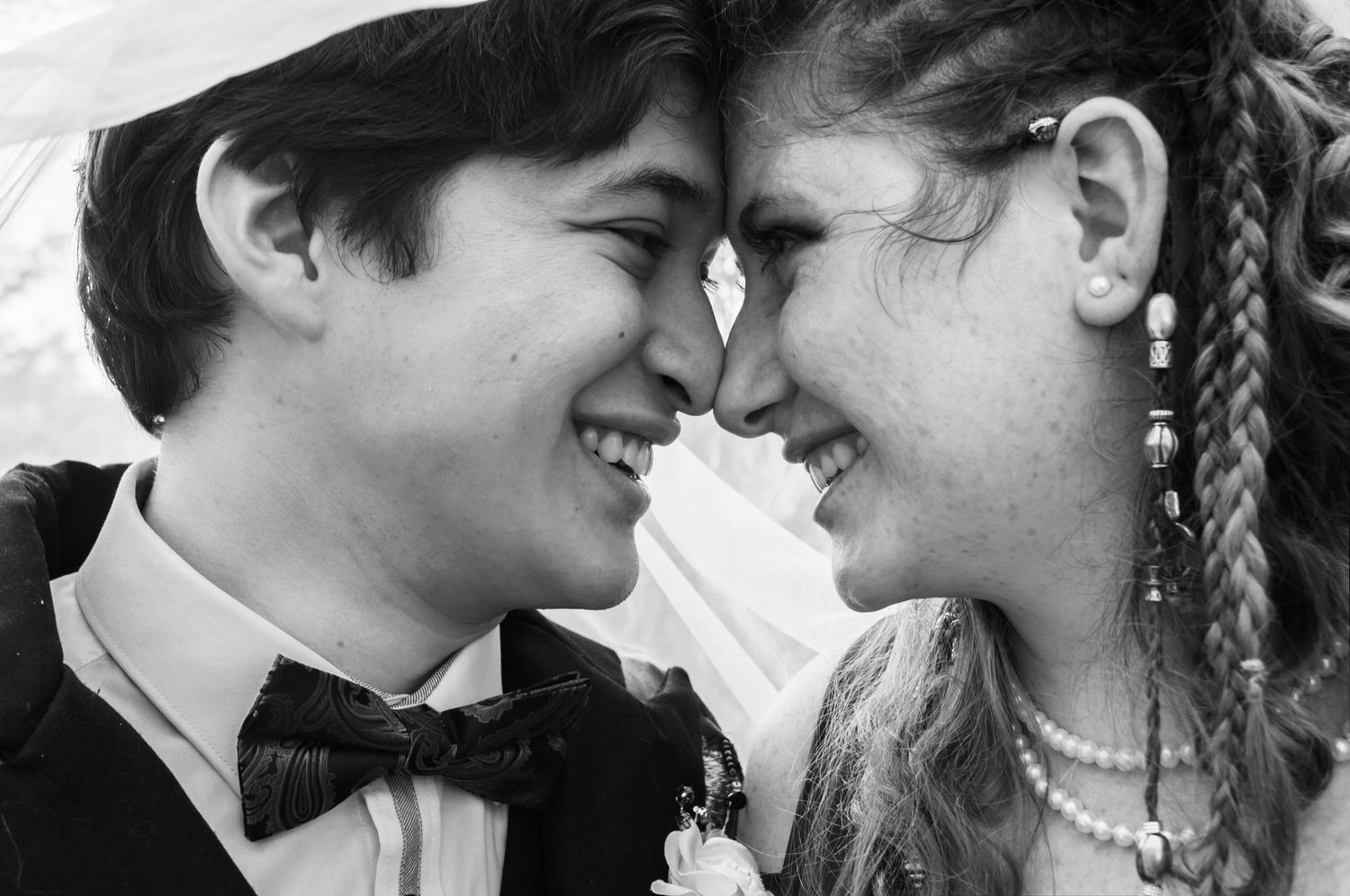 Series of intimate black and white close-up shots showing tender moments.