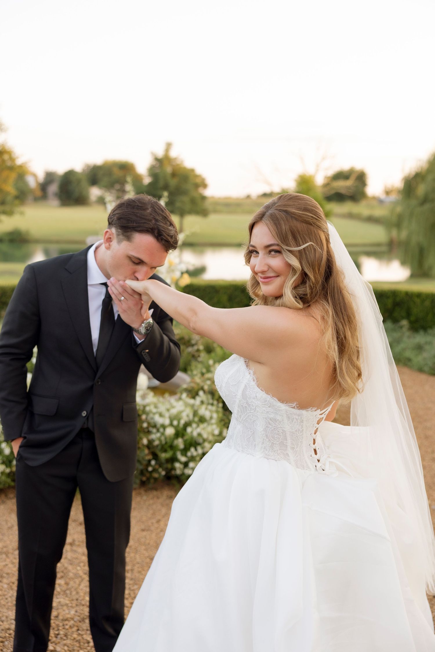 Candid moments between a bride and groom sharing laughter during their sunset wedding photoshoot.