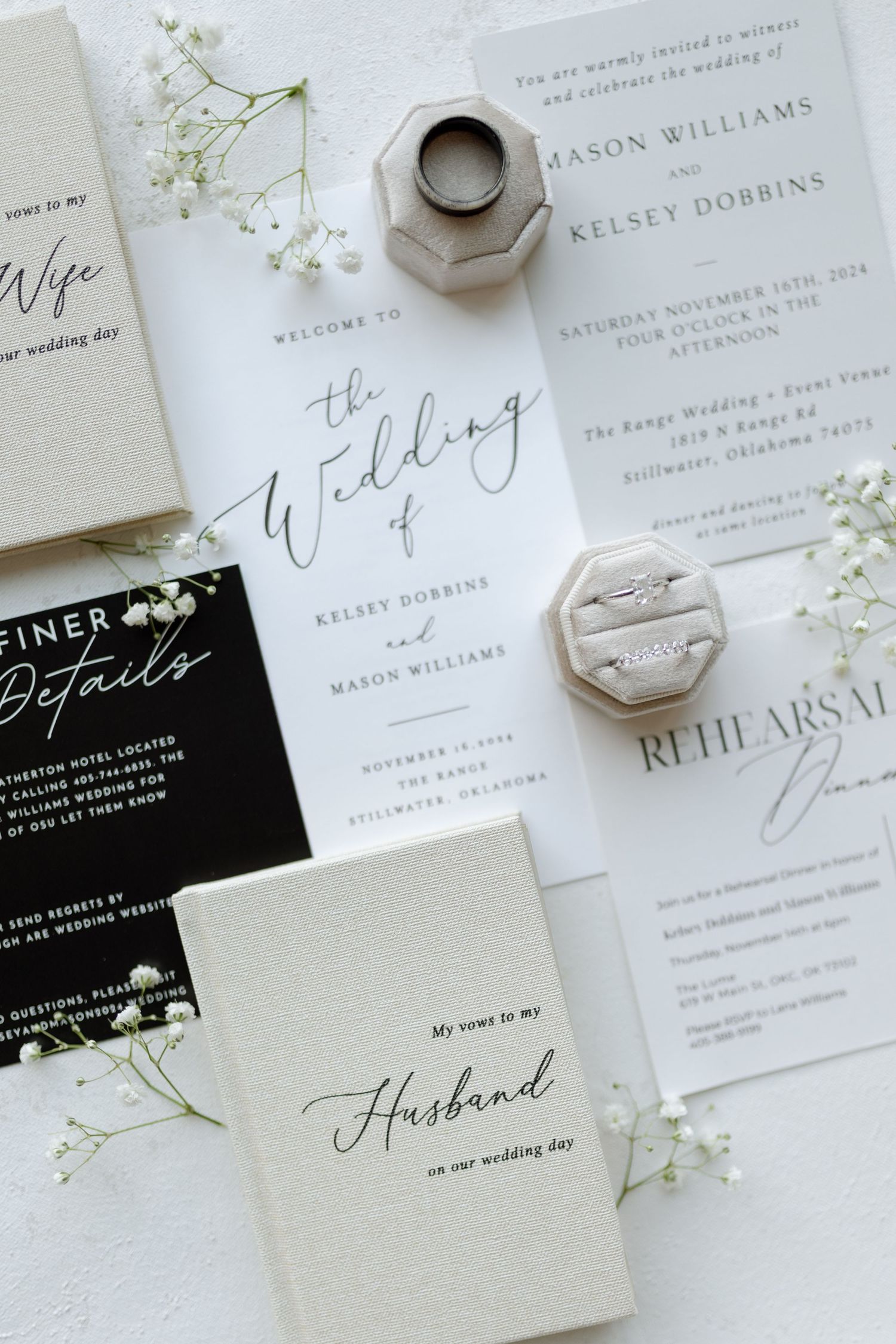 Wedding invitation suite with geometric ring holder and delicate baby's breath flowers.