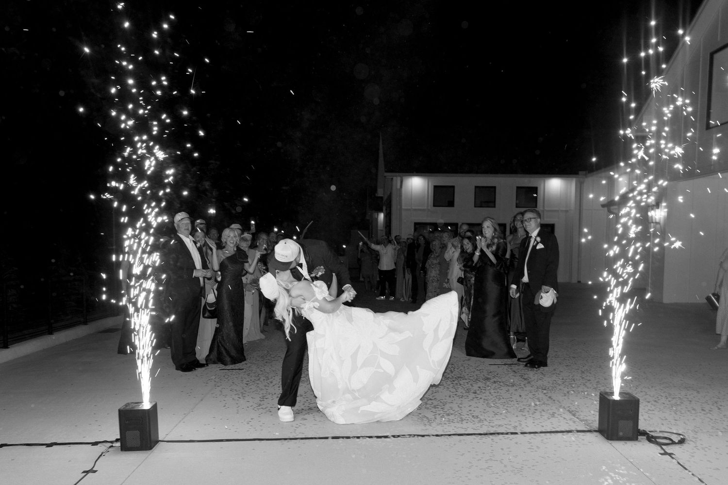 A series of wedding reception dance photos with sparklers creating magical light effects on the dance floor.