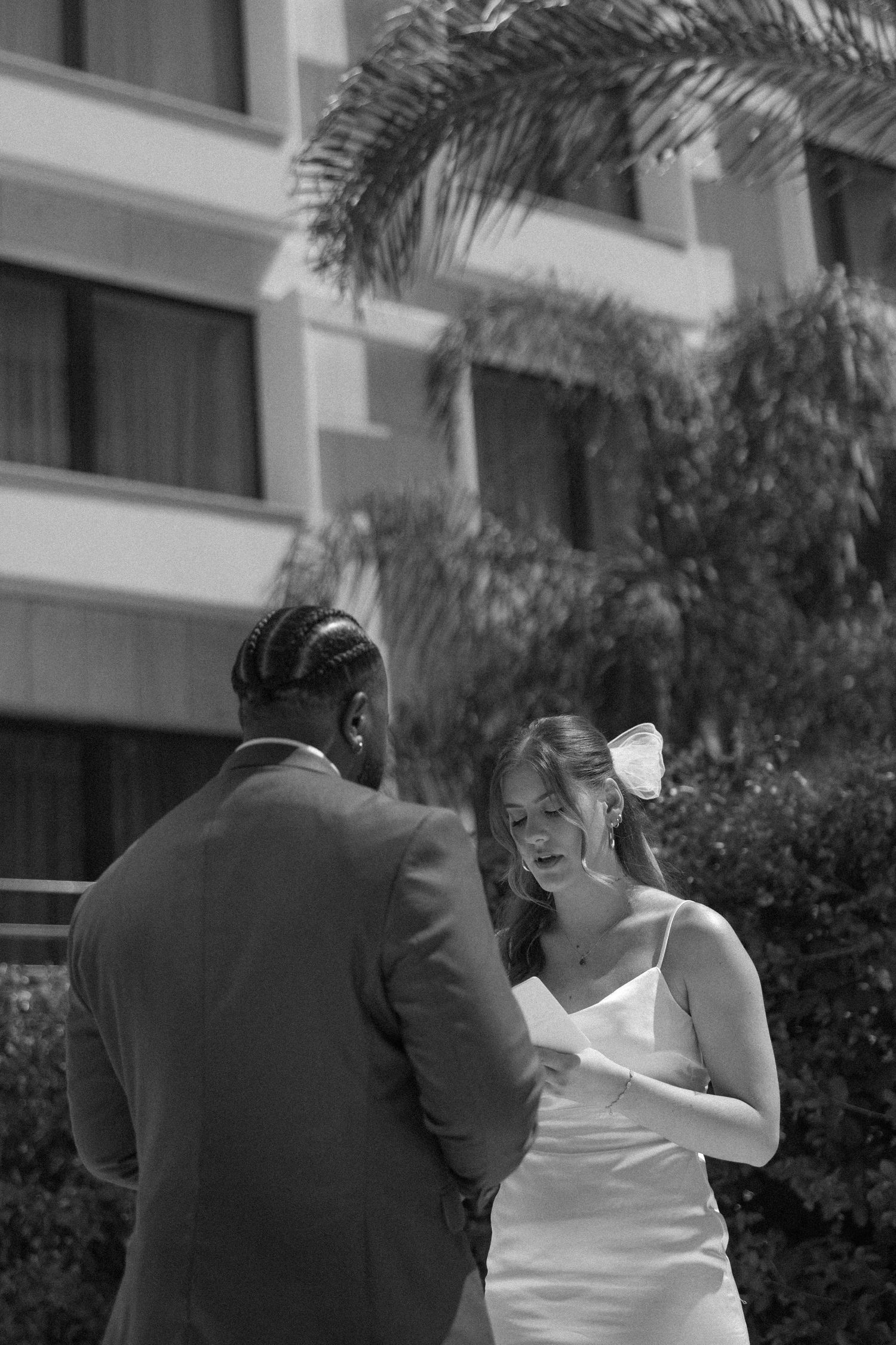 A black and white capture of a couple sharing an emotional moment during their ceremony.