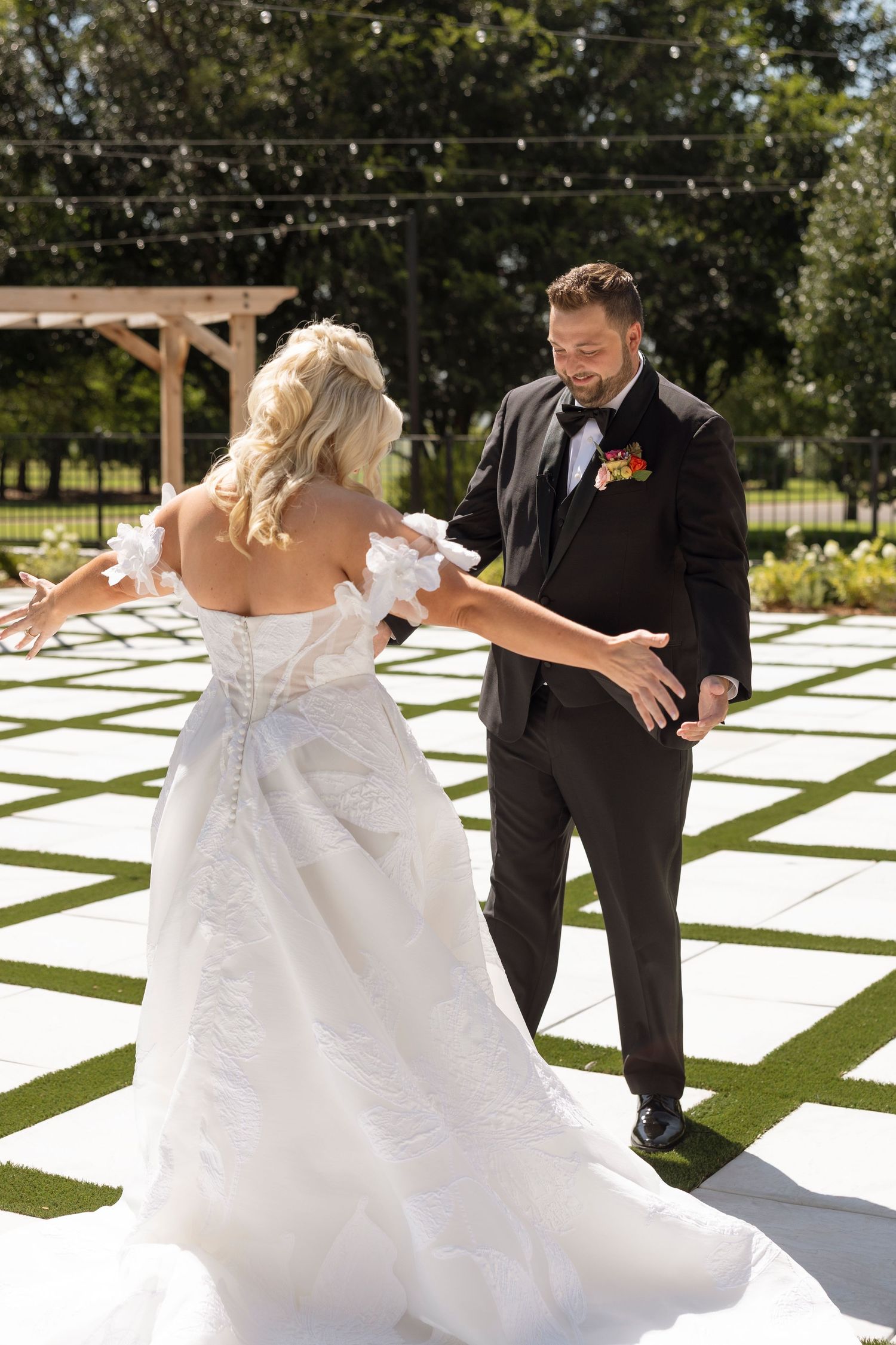 Sequence of joyful dance moves on an outdoor white and green checkered dance floor.