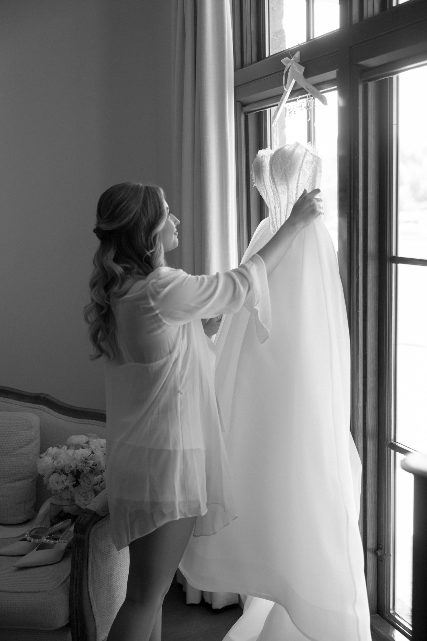 Artistic sequence showing preparation with white flowing fabric against bright windows.