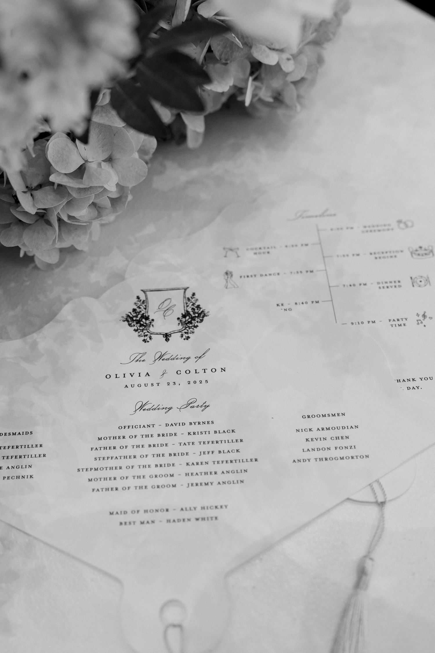 Black and white wedding invitation cards with elegant typography and floral decorations.