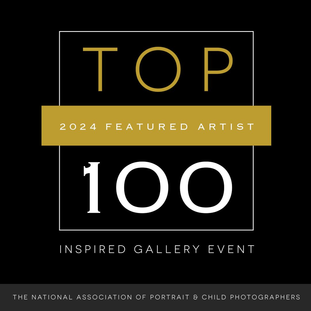 Gold and black badge for Top 100 2024 Featured Artist Inspired Gallery Event by National Association of Portrait & Child Photographers.