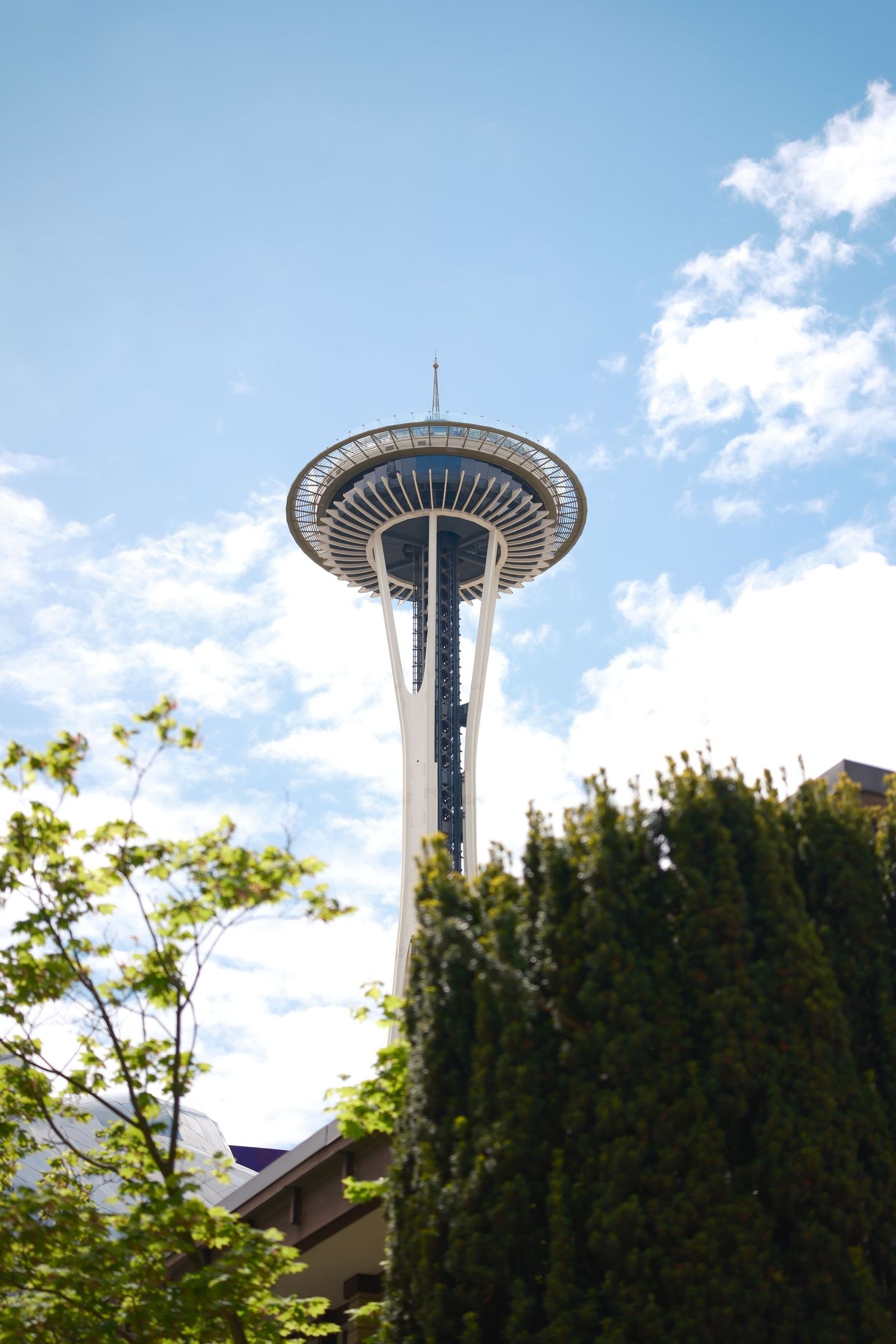 Space Needle photographed against a bright blue sky in Seattle, Washington.