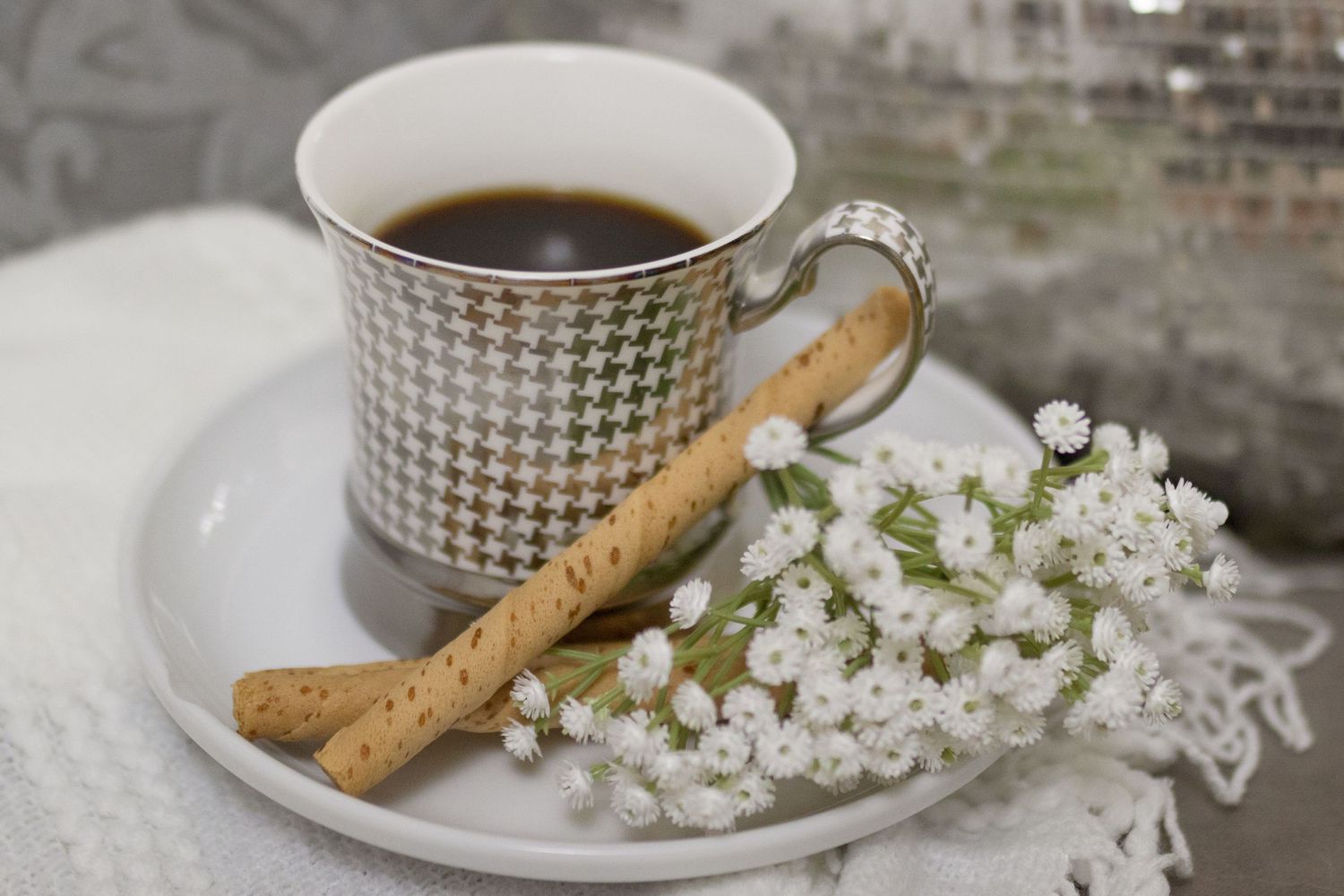 Coffee, flowers, and a cookie, set out for a warm welcome at Lock and Key Photography's Fort Worth boudoir studio.