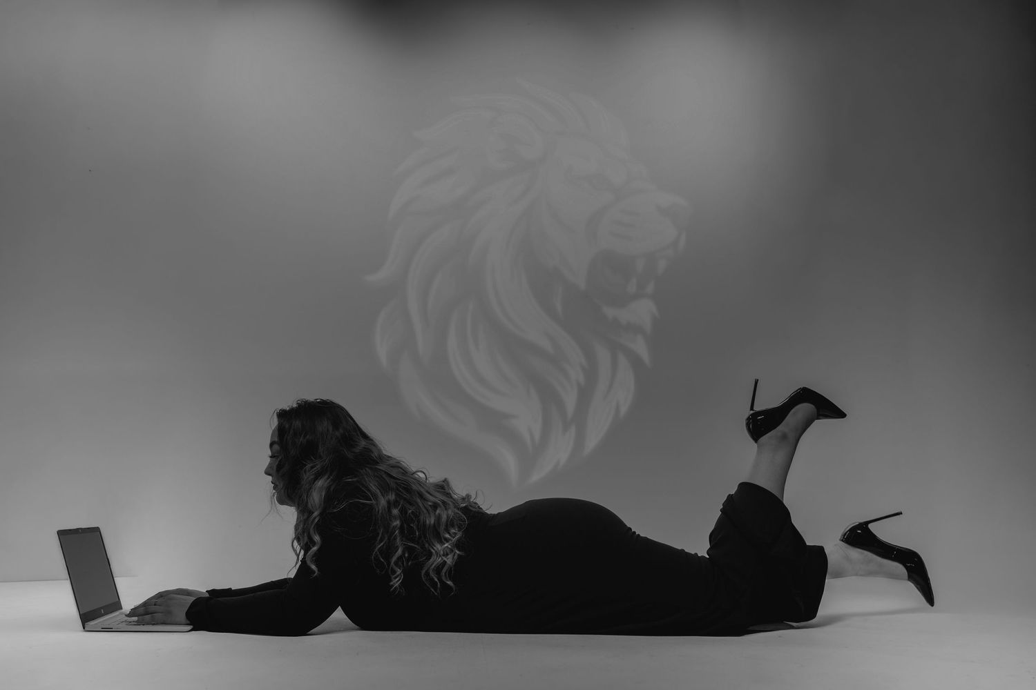 A sequence of silhouettes showing a person rolling over in a progressive motion against a light background.