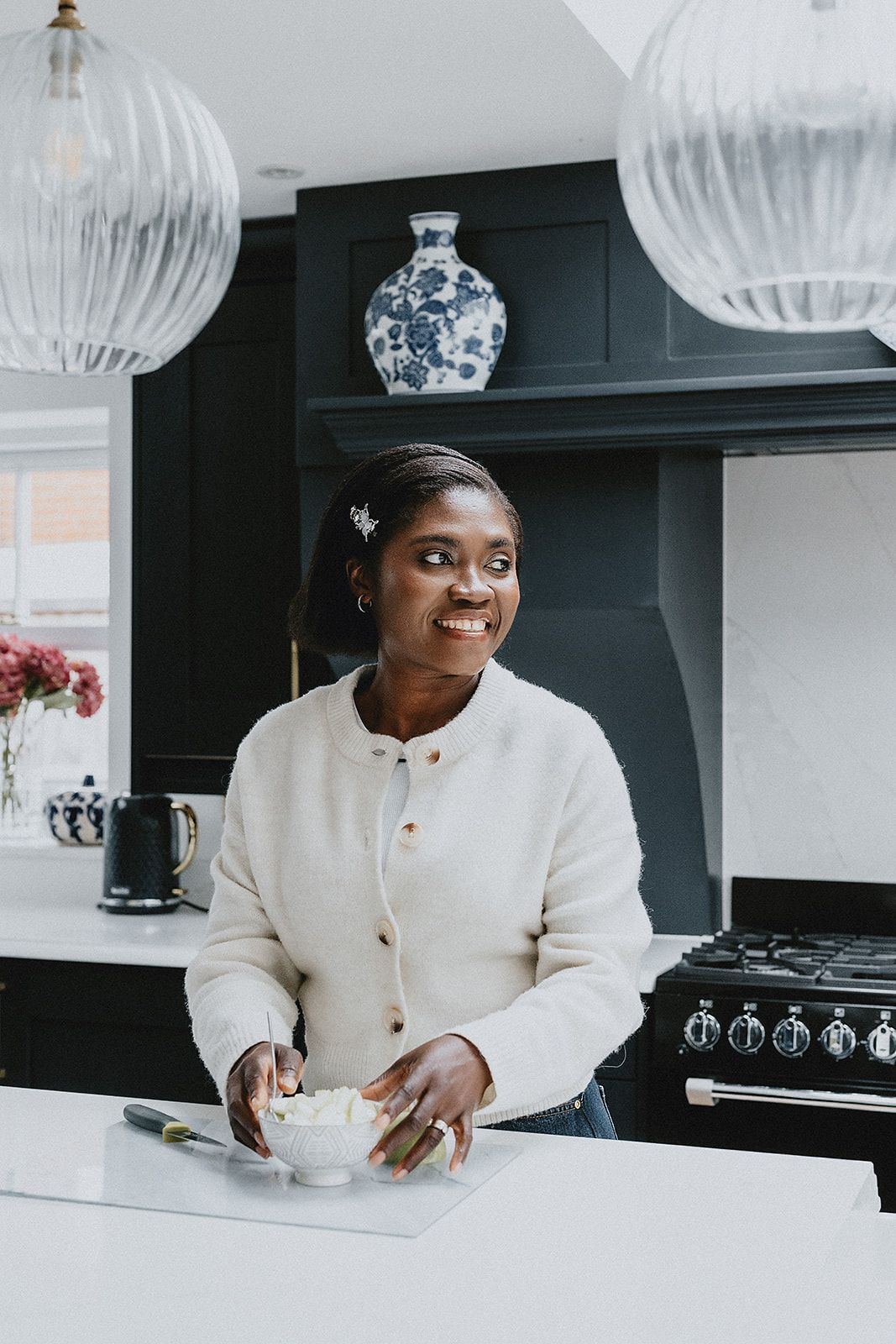 Lifestyle brand photography showing a business owner in a modern kitchen, creating relaxed and professional brand imagery