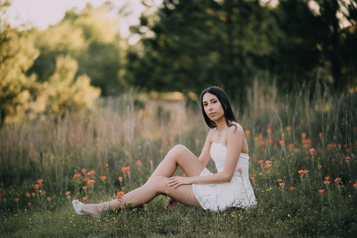 A dreamy outdoor portrait session in a wildflower meadow at golden hour.