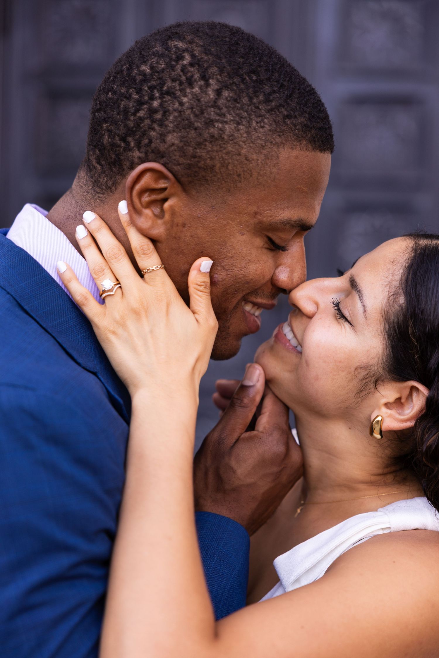 A tender romantic moment between a couple sharing an intimate close embrace.