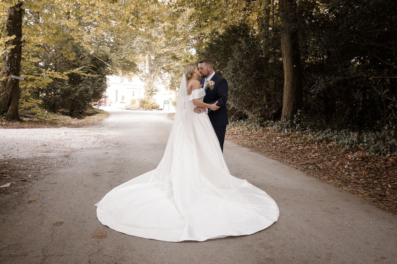 Wedding photography sequence on a tree-lined path showcasing a flowing bridal gown.