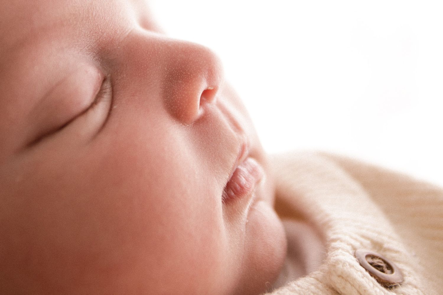 Peaceful sleeping baby captured in soft natural light.