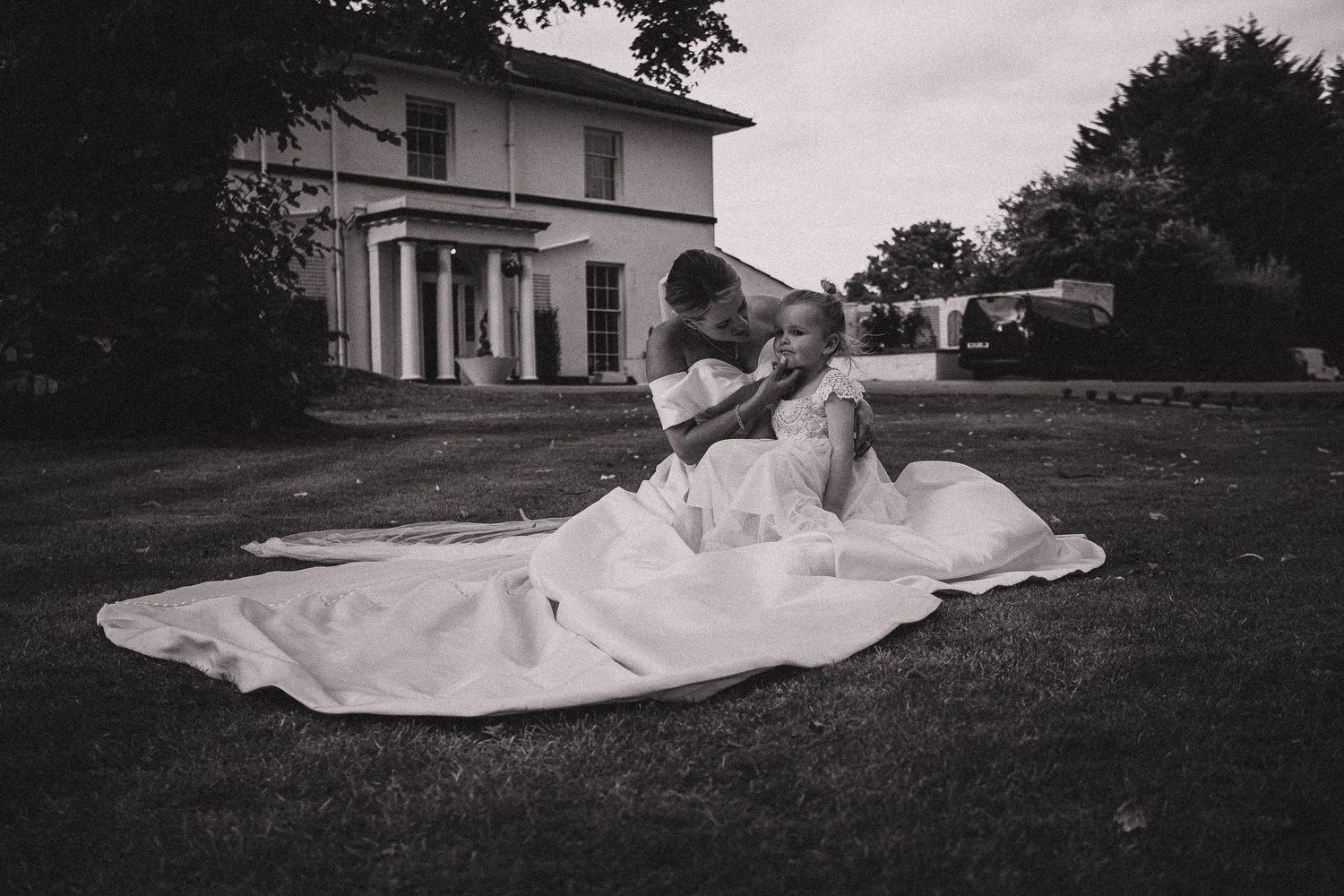 Black and white panoramic series showing a bride's flowing dress movement on a hillside.