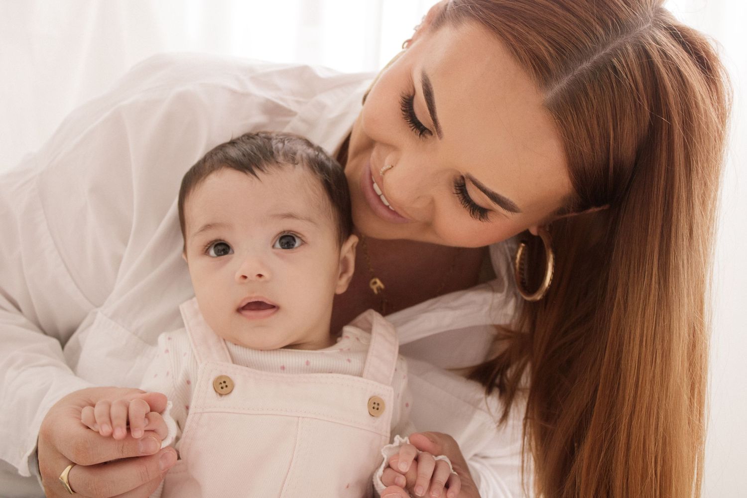 A tender moment between parent and child in a soft, warm-toned photo collage.
