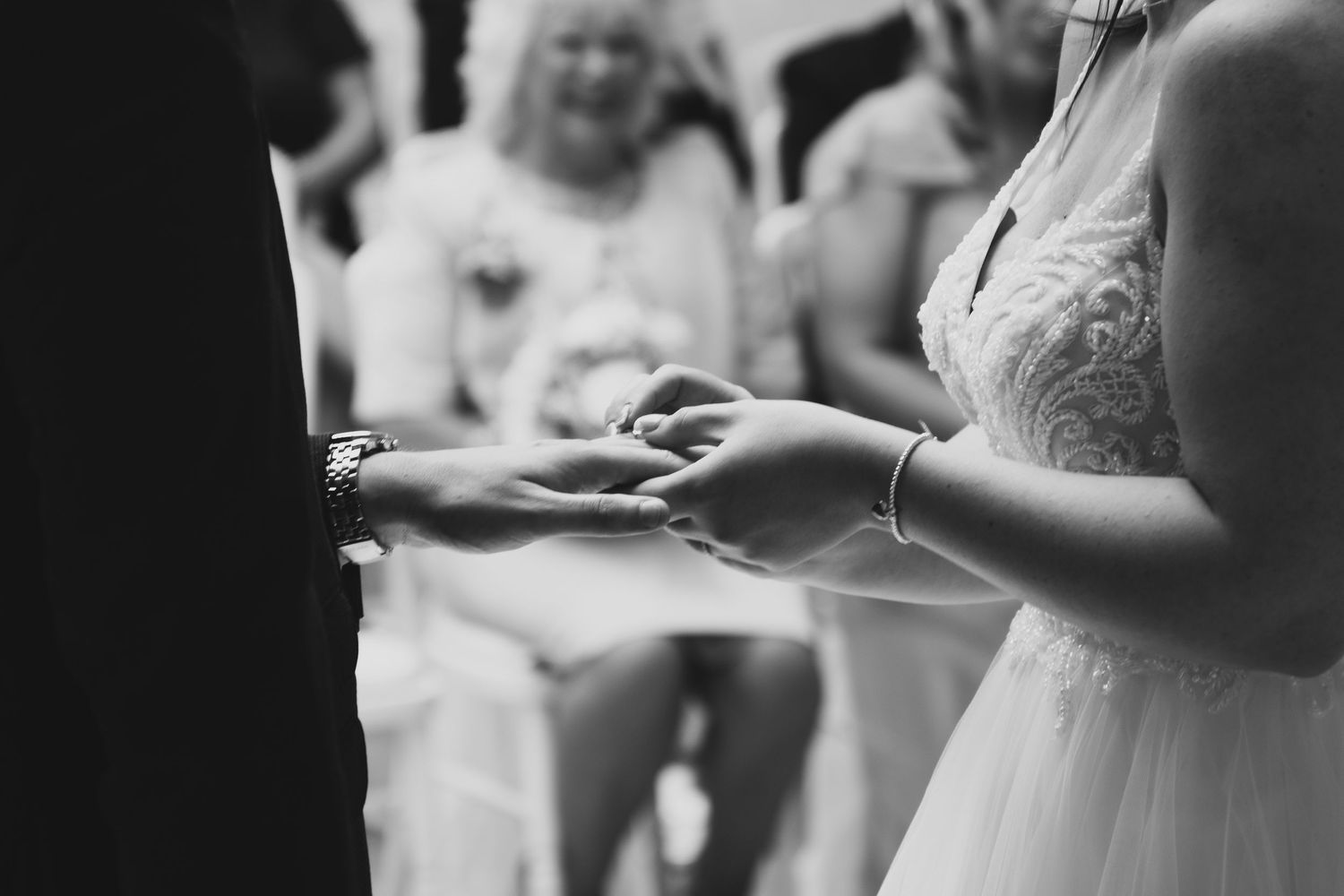 Black and white candid shots of wedding ceremony details.