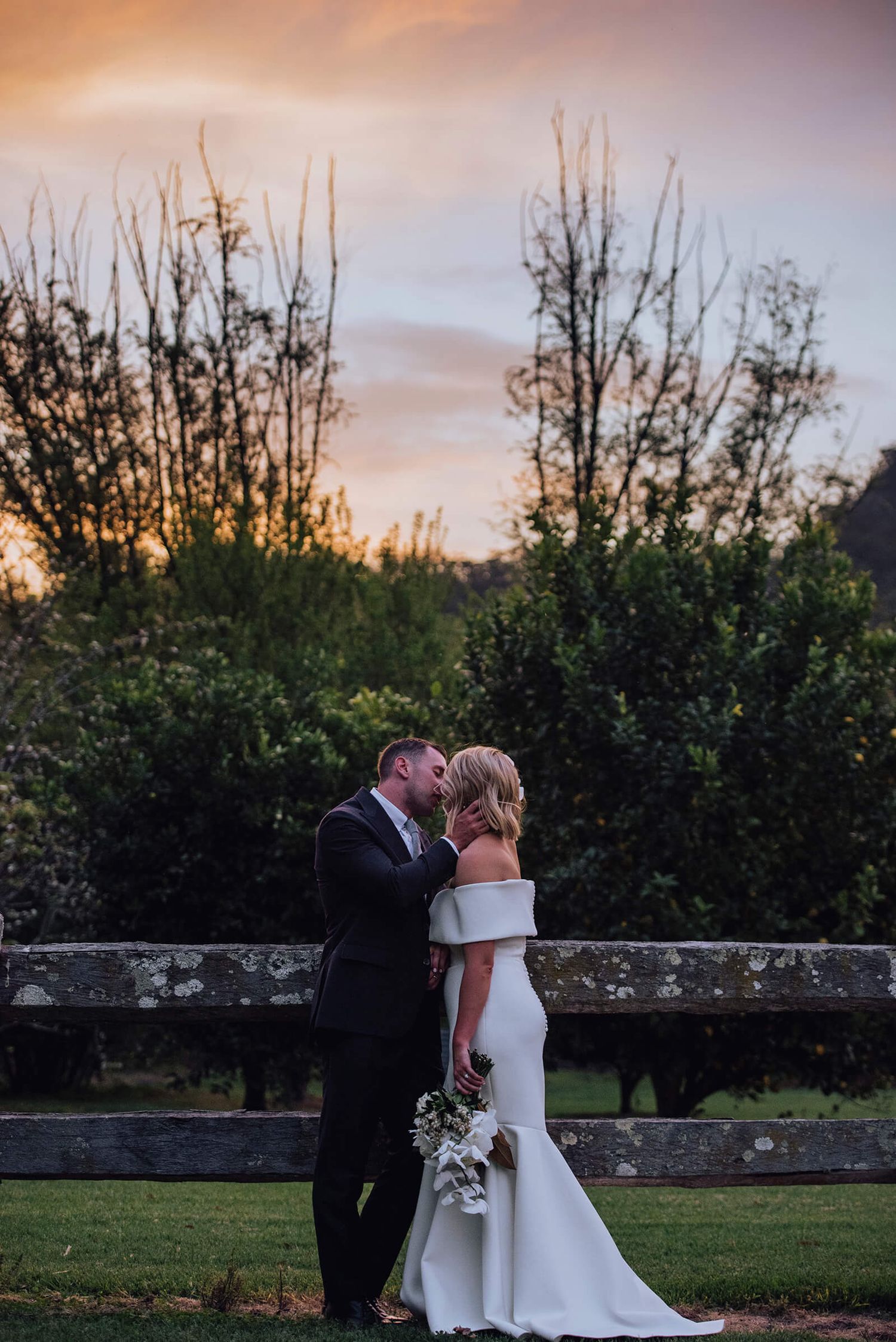 Bride and groom kissing at sunset in Kangaroo Valley - Zara King Photography, Sydney Australia