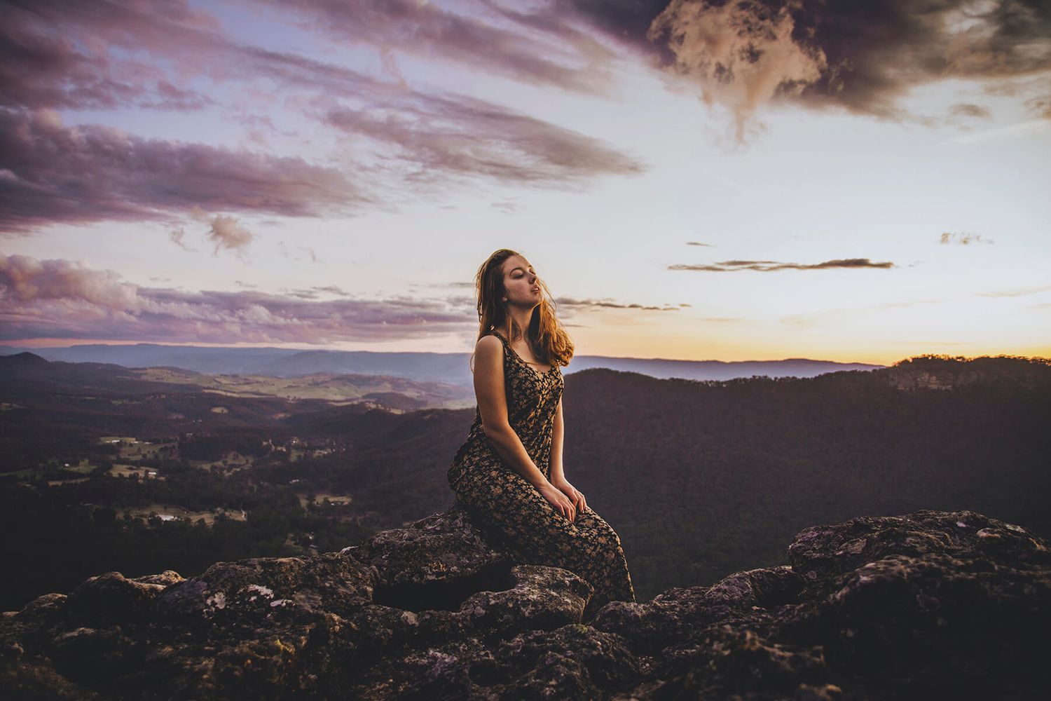 Girl sitting on rock at sunset during modelling photo shoot in Mt Victoria, Blue Mountains - Zara King Photography, Sydney Australia
