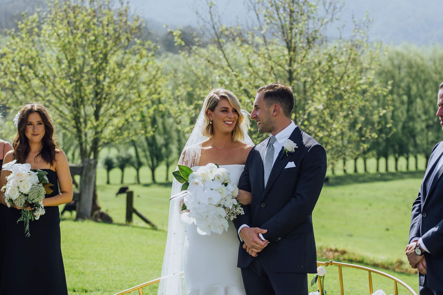Bride and groom looking at each other during ceremony in Kangaroo Valley - Zara King Photography, Sydney Australia