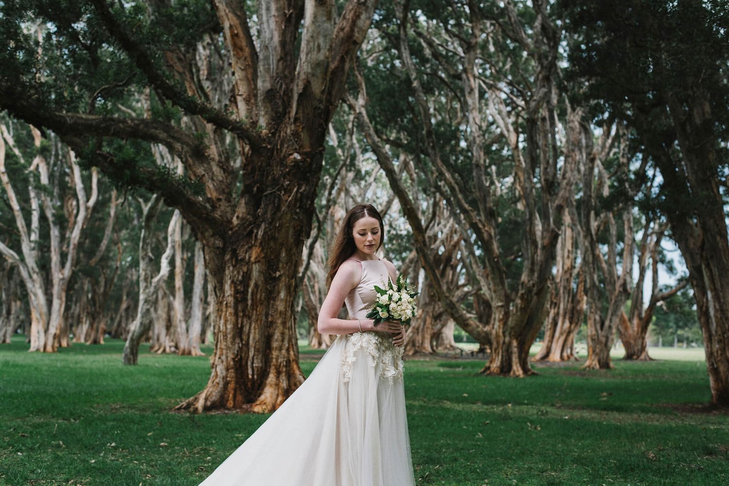 Bride surrounded by trees in Centennial Park - Zara King Photography, Sydney Australia
