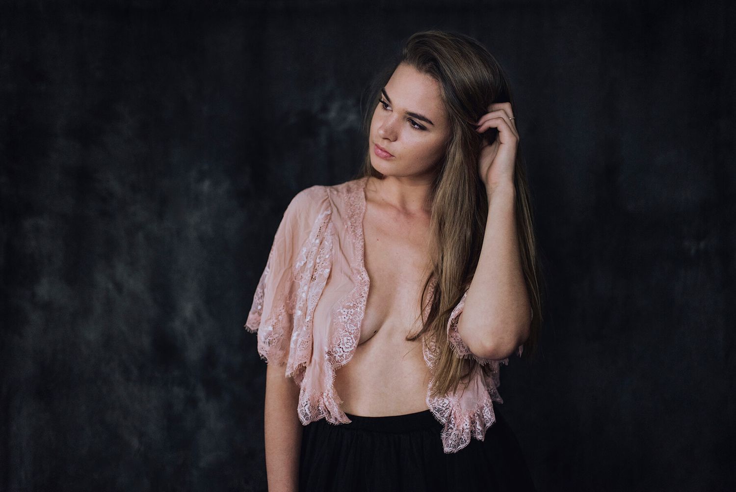 Girl tucking hair behind ear during in-home modelling photo shoot - Zara King Photography, Sydney Australia