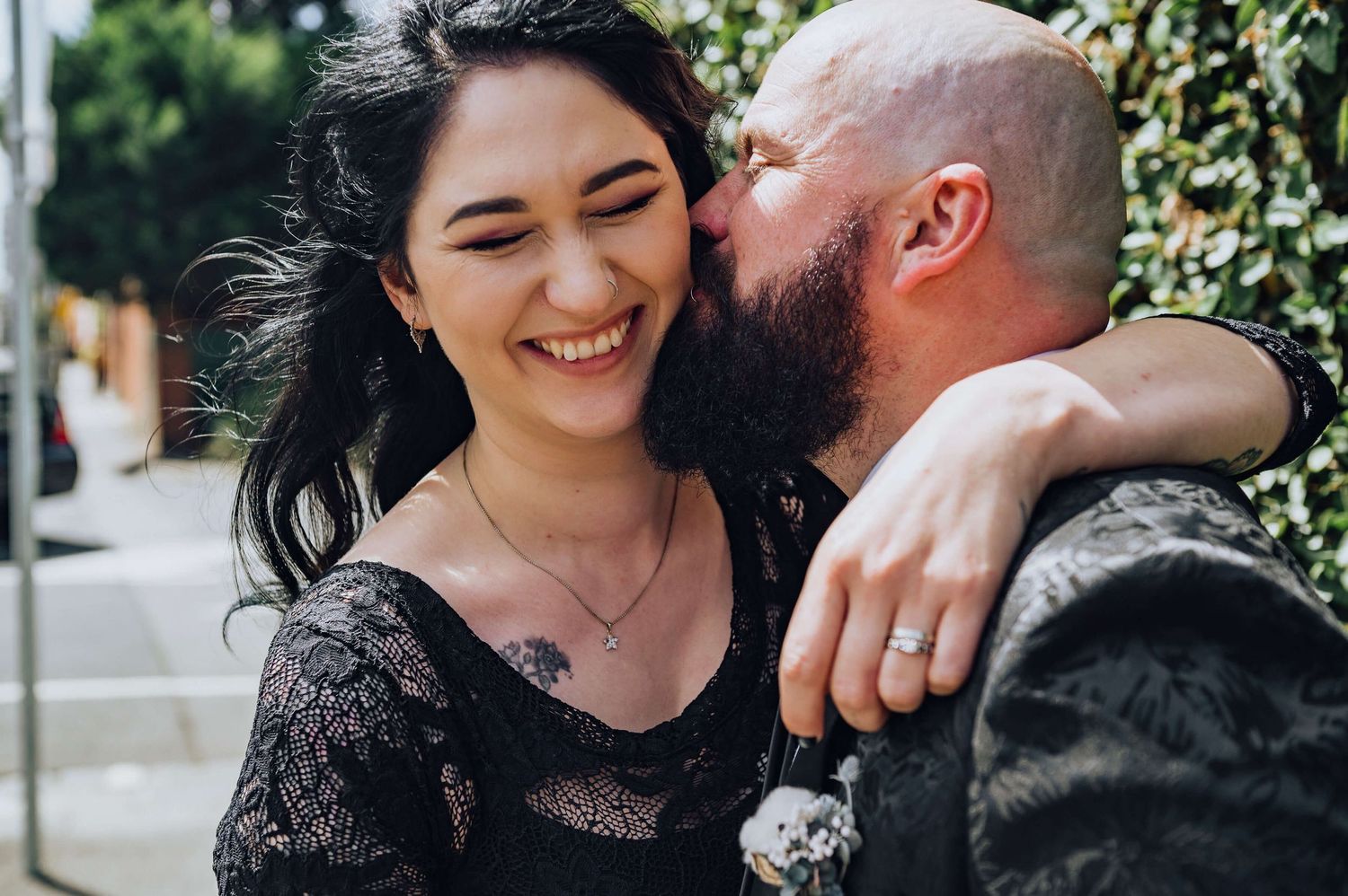 Close up of groom kissing bride's cheek in Fitzroy, Melbourne - Zara King Photography