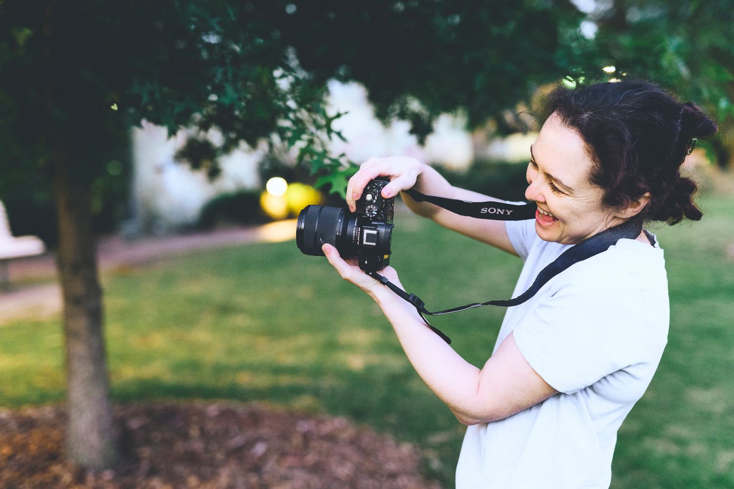 Woman laughing while learning how to use her camera - Zara King Photography, Sydney Australia