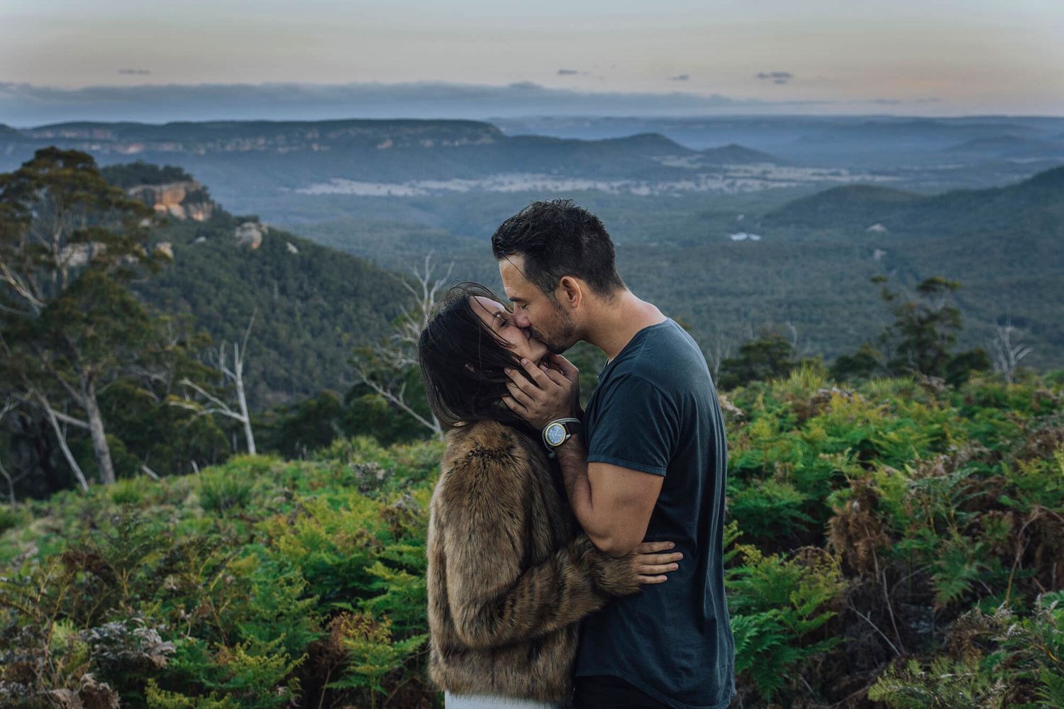 Newly engaged couple kissing during sunset in Blue Mountains - Zara King Photography, Sydney Australia
