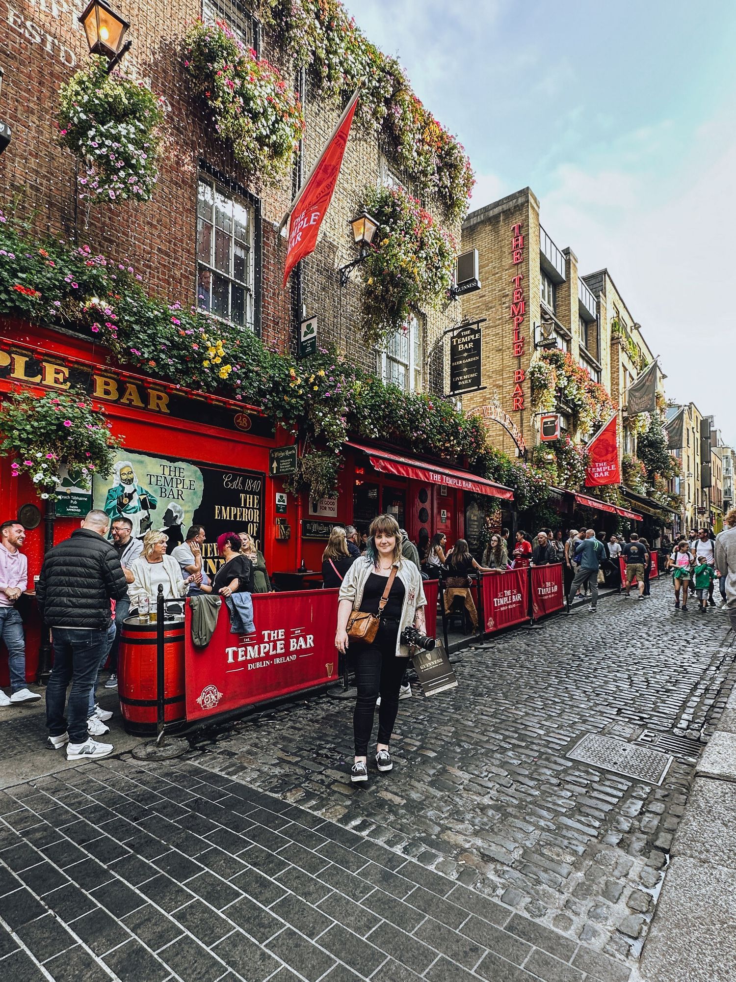 Girl standing in front of The Temple Bar in Dublin, Ireland  - Zara King Photography