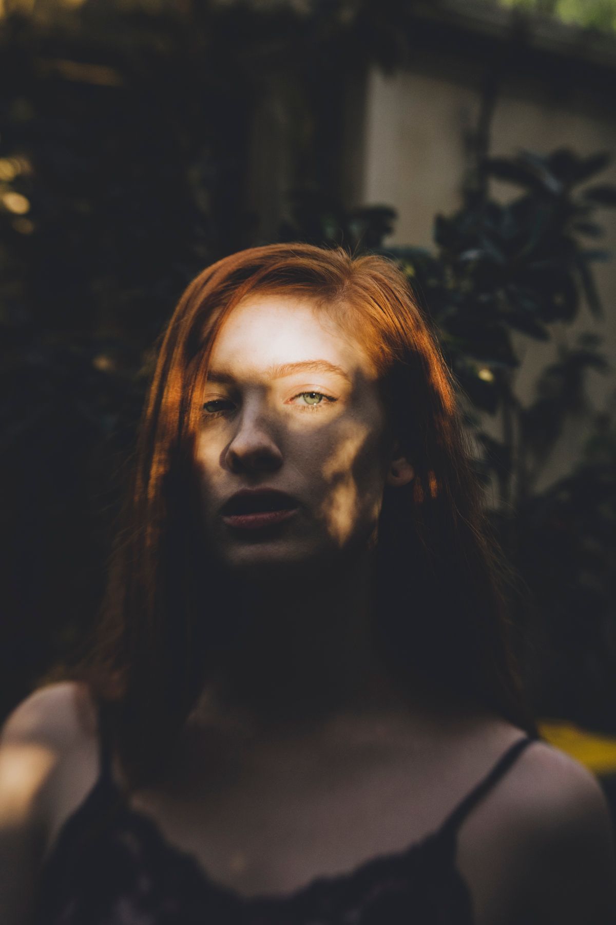 Model half obscured by mottled sunset light during outdoor photo shoot in Paddington - Zara King Photography, Sydney Australia