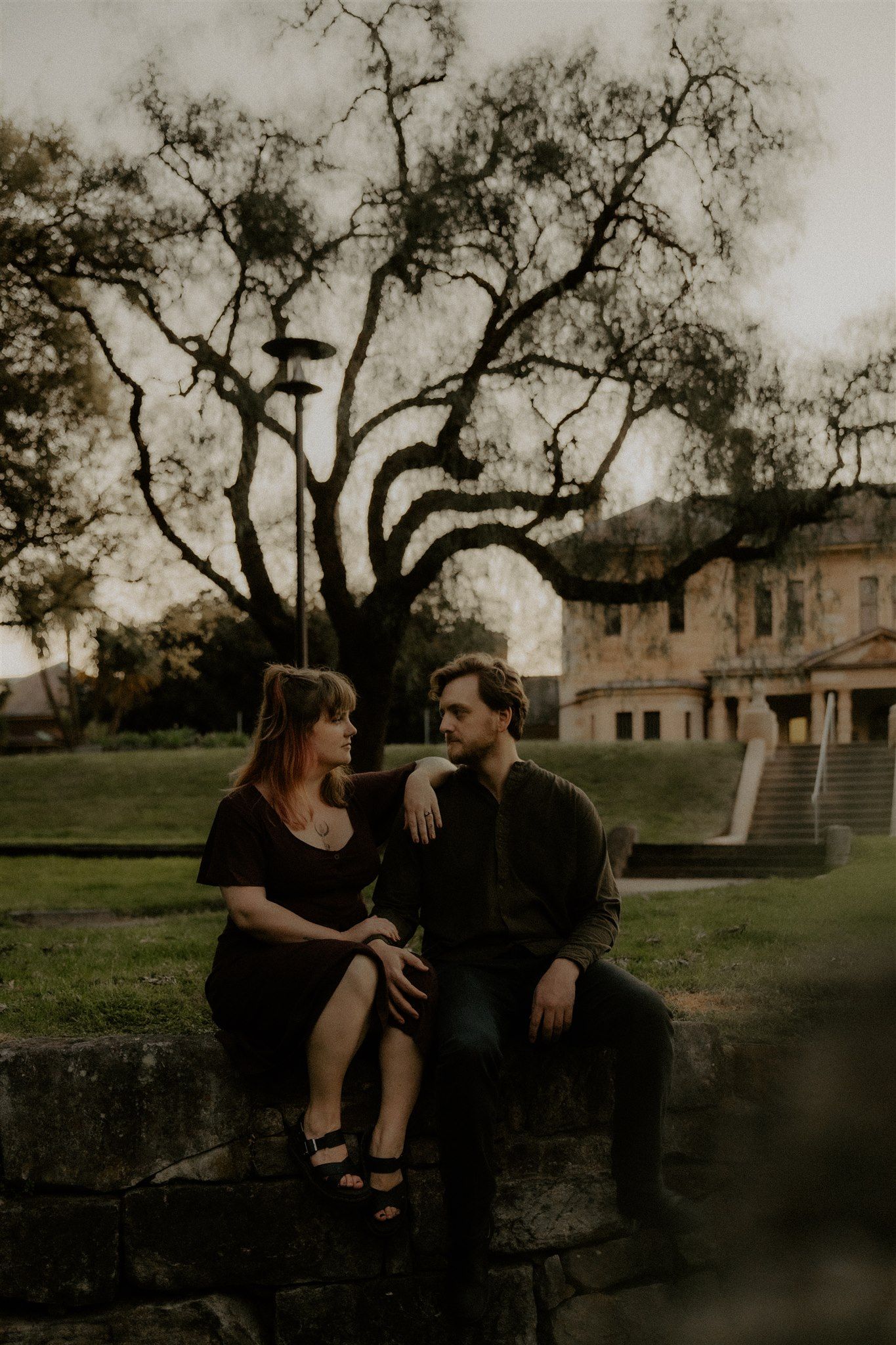 Zara King and fiancé sitting looking at each other
