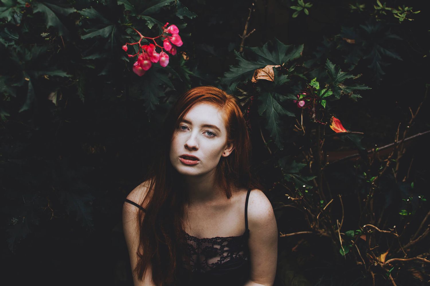 Girl surrounded by flowers during outdoor modelling photo shoot in Paddington - Zara King Photography, Sydney Australia