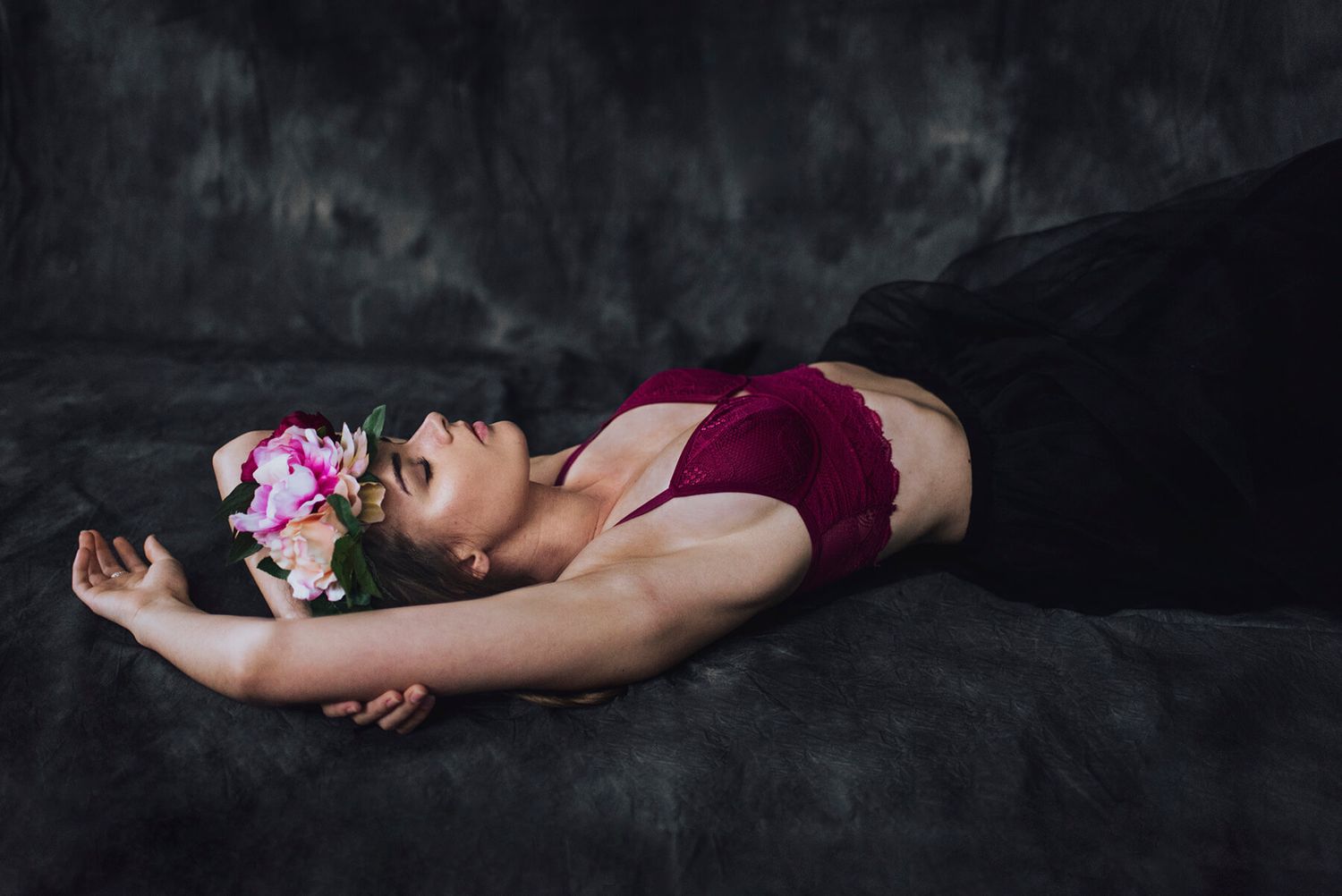 Girl lying on ground wearing flower crown during in-home modelling photo shoot - Zara King Photography, Sydney Australia