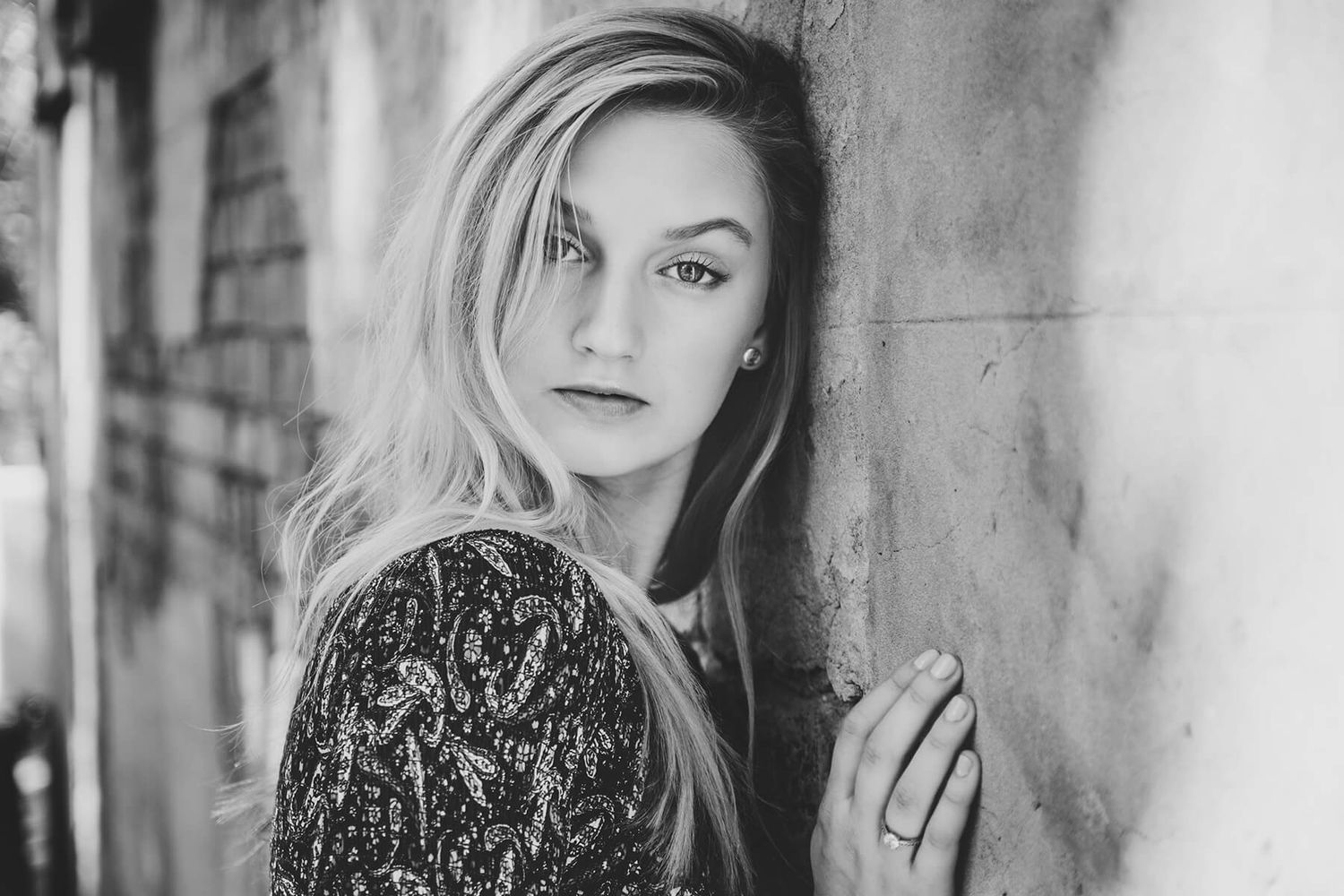 Girl leaning on wall looking at camera during modelling photo shoot in Newtown - Zara King Photography, Sydney Australia