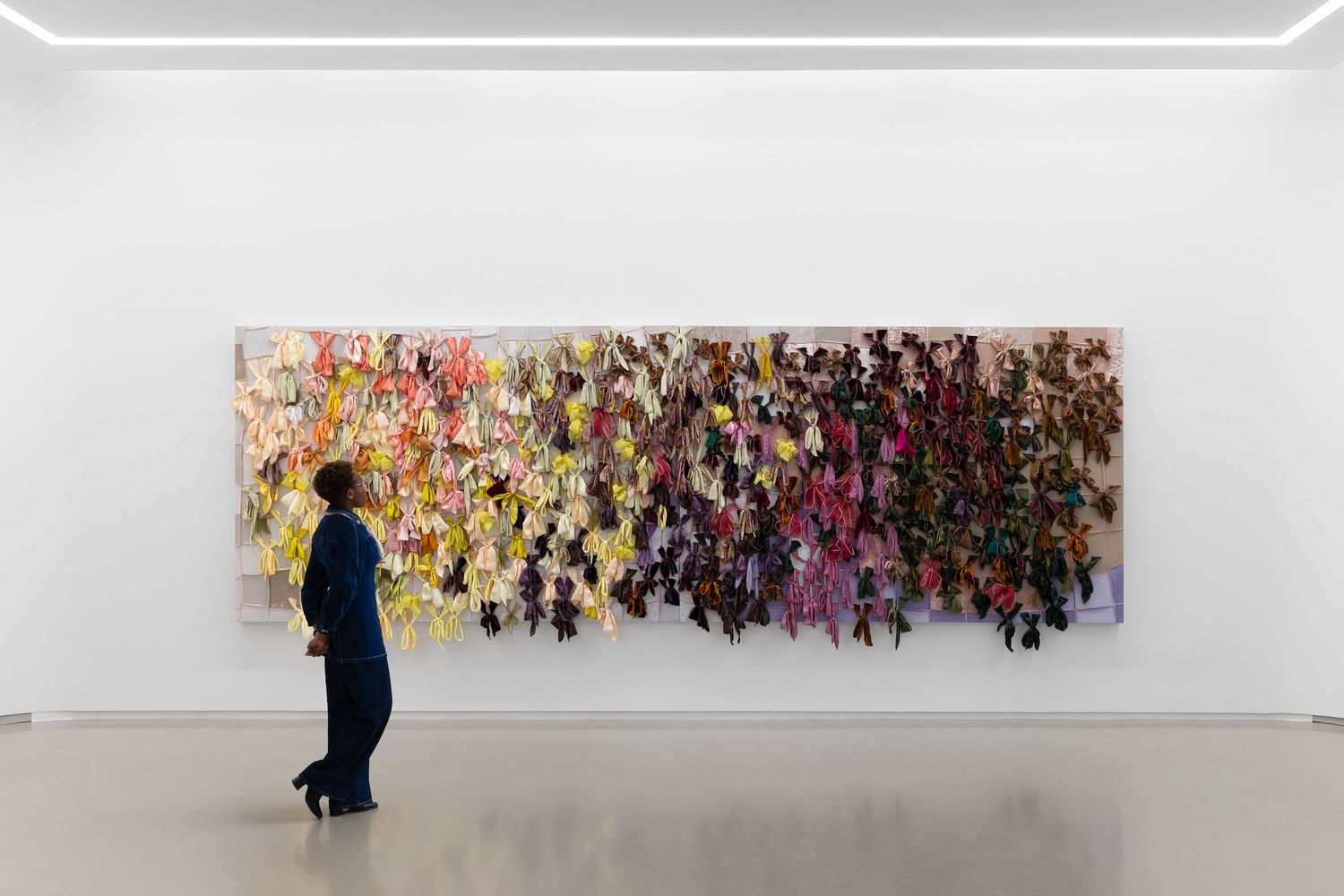 Gallery interior at The Shepherd in Detroit featuring Arrangements #002 (Detroit) by Anthony Olubunmi Akinbola, with a visitor viewing.