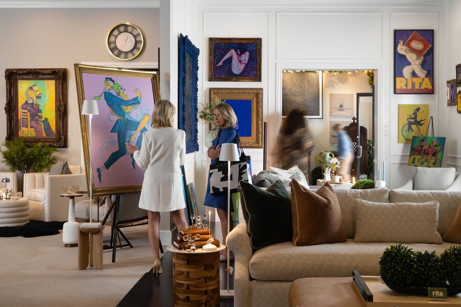 Rita O’Brien showroom at Michigan Design Center featuring Detroit artist Tony Roko with paintings and sculptures in gallery-style display.