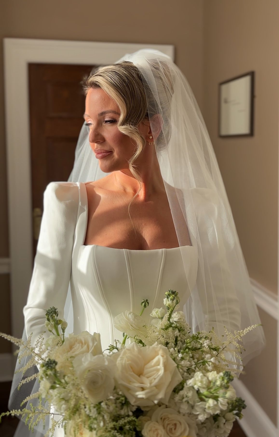 Close-up bridal portraits with white roses and delicate veil details.