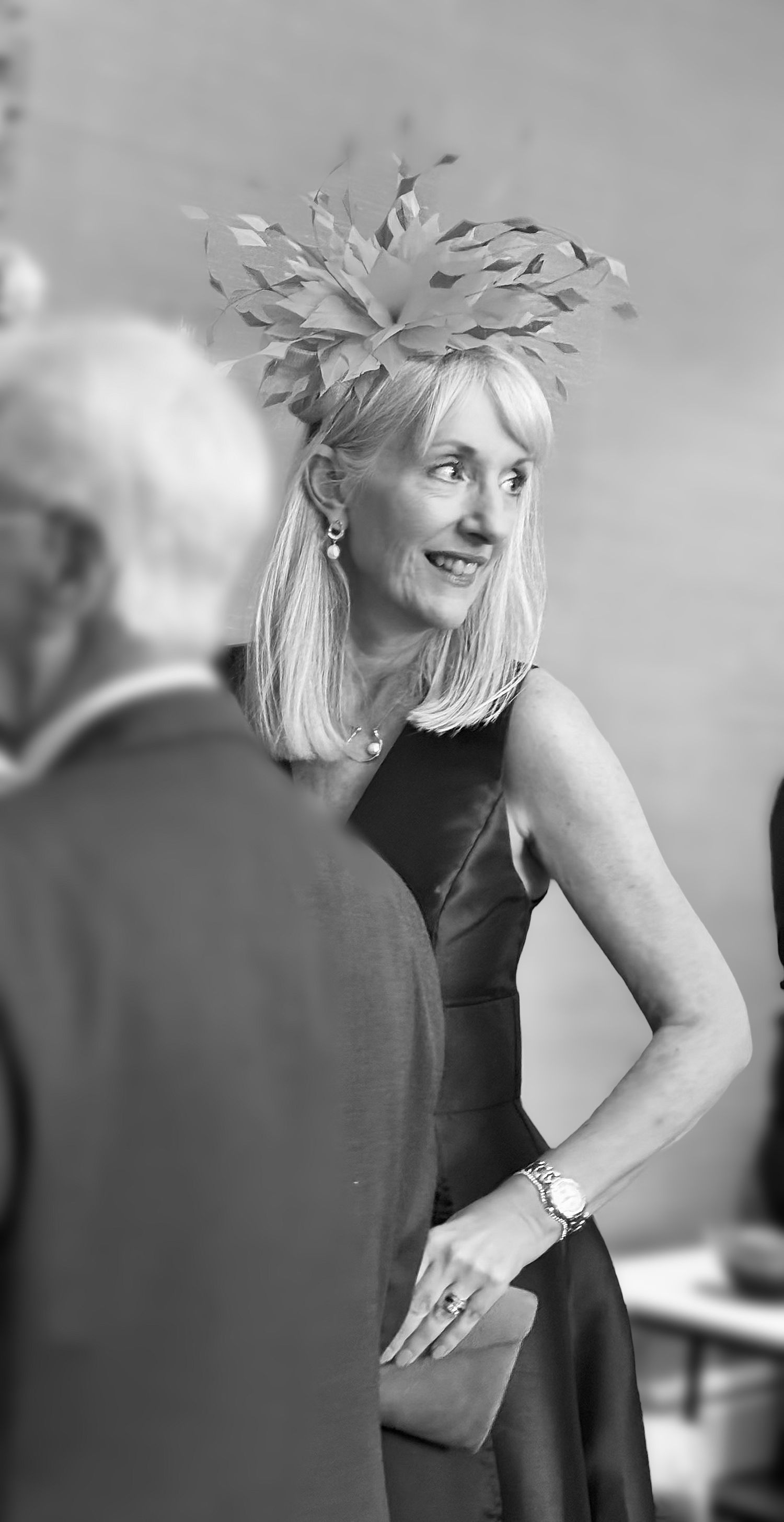 A person in black wearing a silver headpiece poses elegantly at an event.creation wedding content
