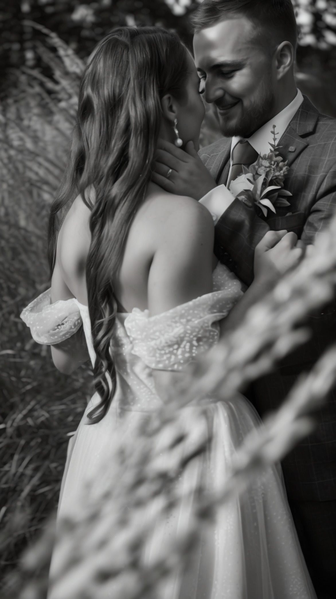Romantic black and white wedding portraits showing intimate moments between newlyweds in a garden setting. wedding content