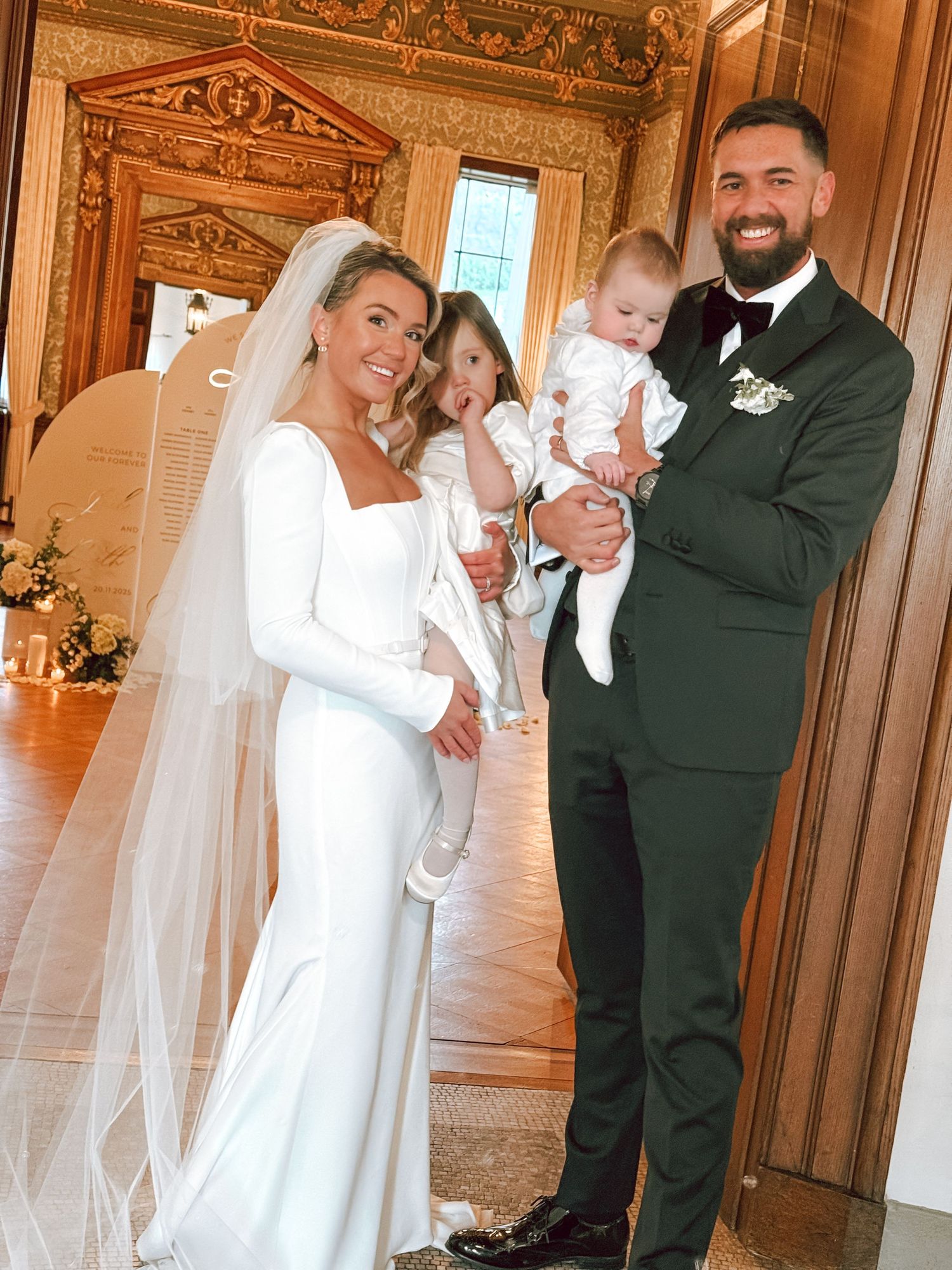 Wedding party photos in an ornate room with elegant wood paneling and decor.